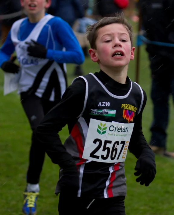 a  running on the grass at a race