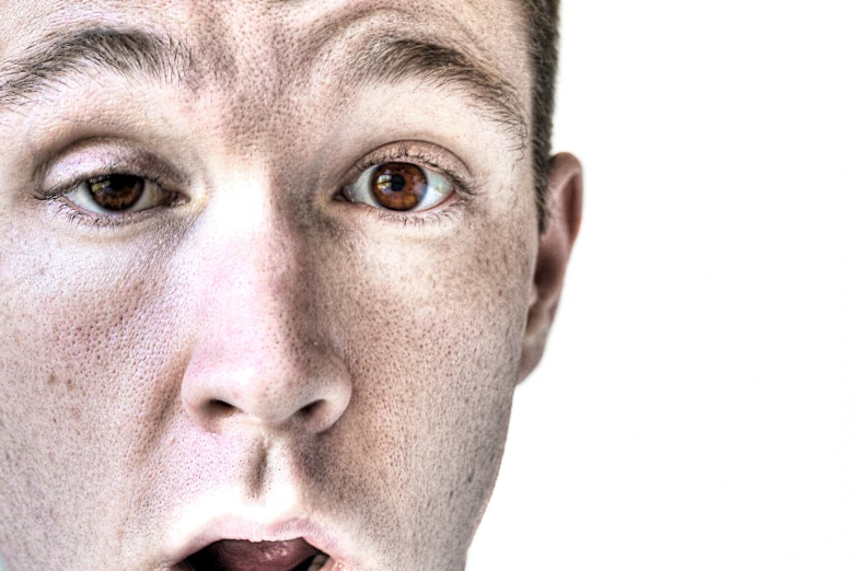 a man with freckled, speckled hair is making a shocked face