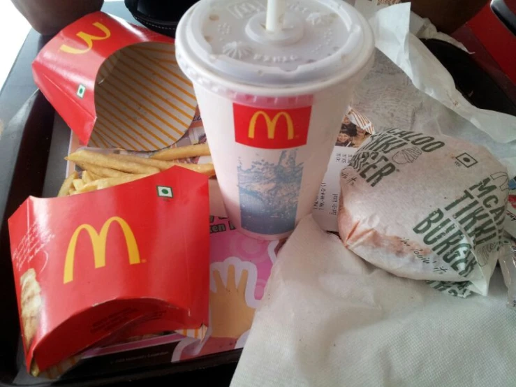 food and drink on tray in restaurant with wrapping