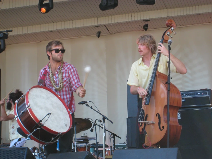 some musicians are playing instruments at a concert