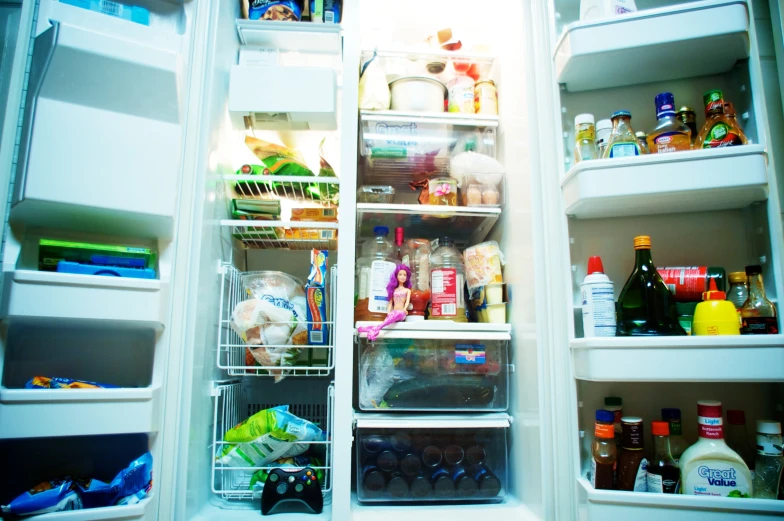 an open fridge filled with lots of foods