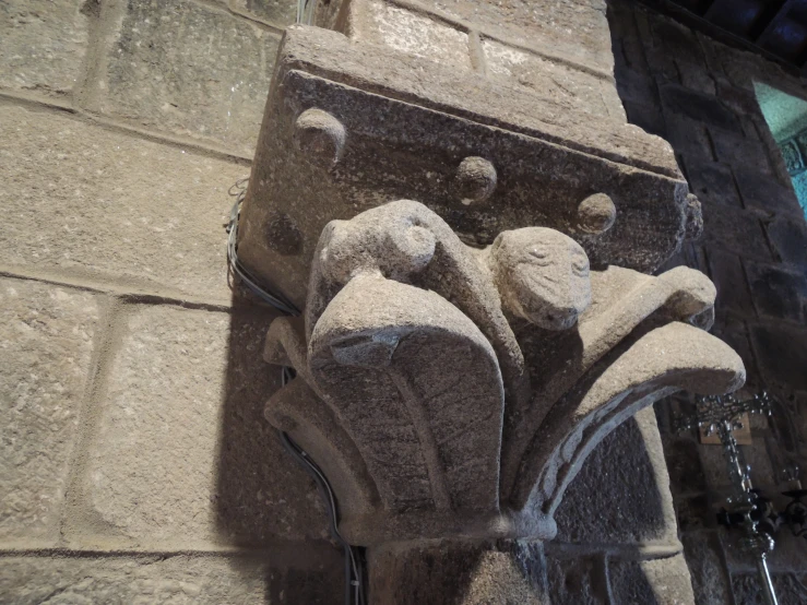 a decorative carving on the side of a building