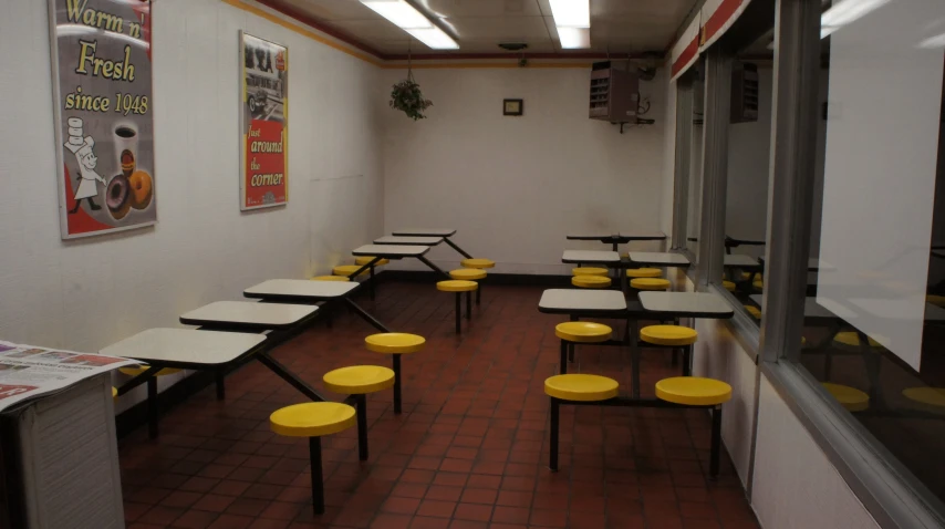 a very nice looking classroom with yellow chairs