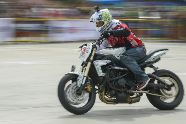 a person riding on a motorcycle that is turning left