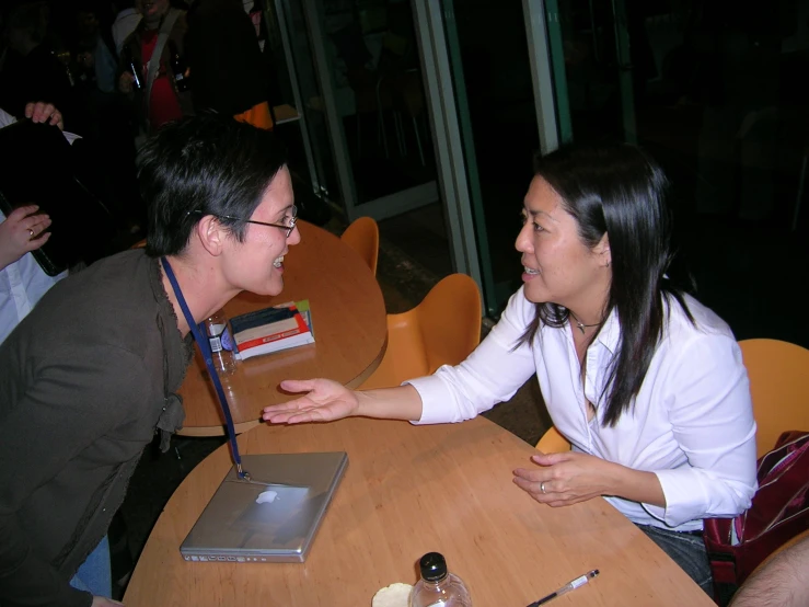 a man and a woman sitting at a table