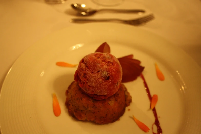 a plate topped with a dessert covered in fruit