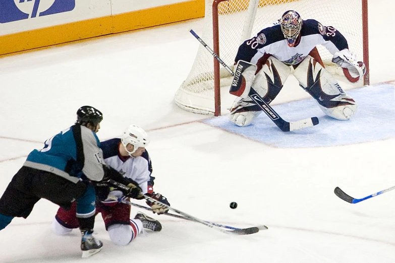 a hockey game being played with players on the ice