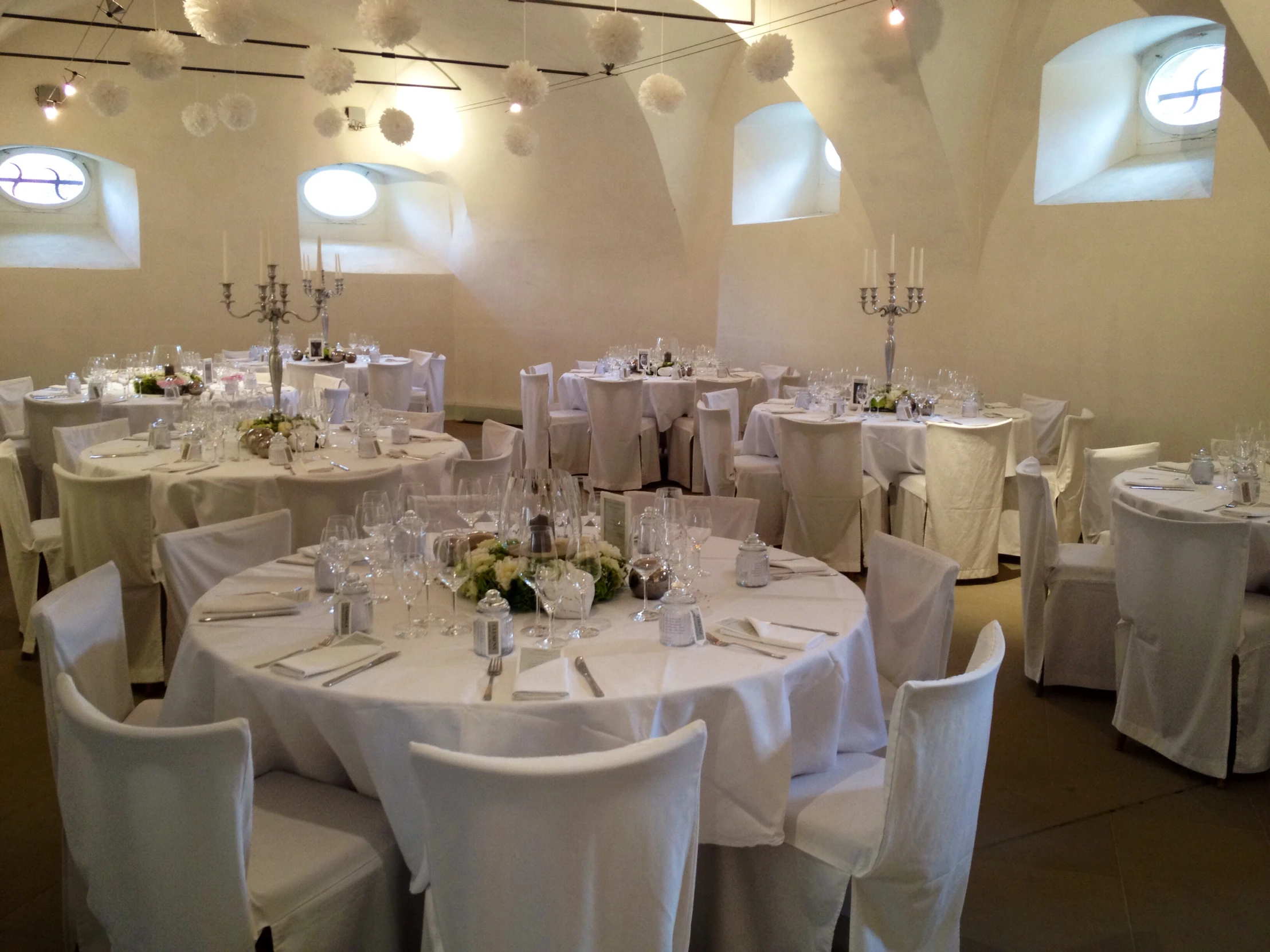 a very large banquet hall with a white color