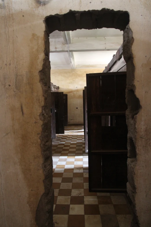 this hallway is quite deserted because of the walls and floors