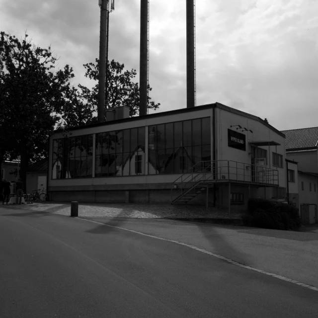 black and white image of an exterior view of an old factory