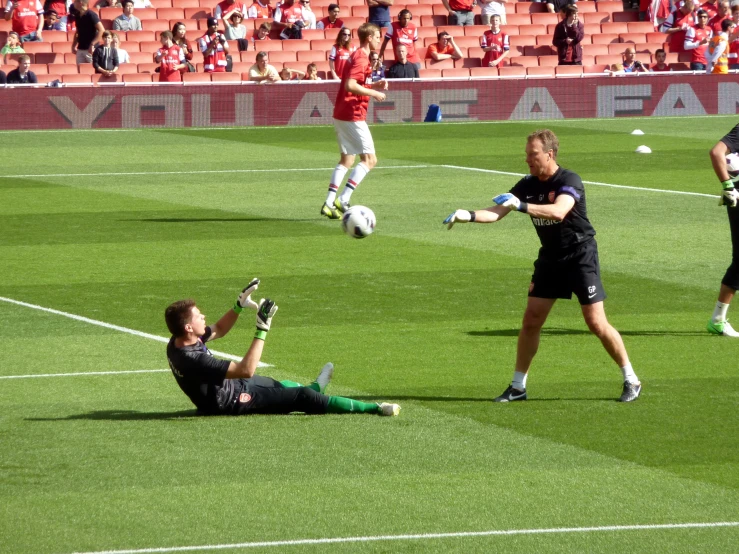 a man is playing with a soccer ball on the field