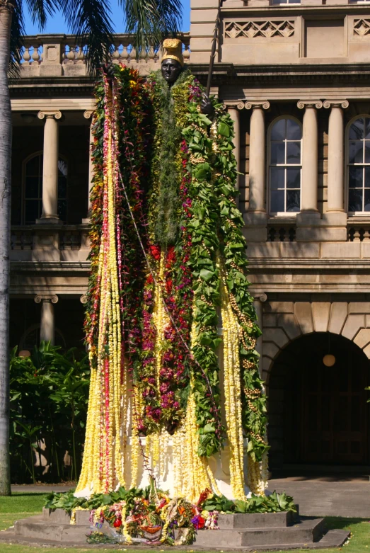 a building with a large building with plants on it