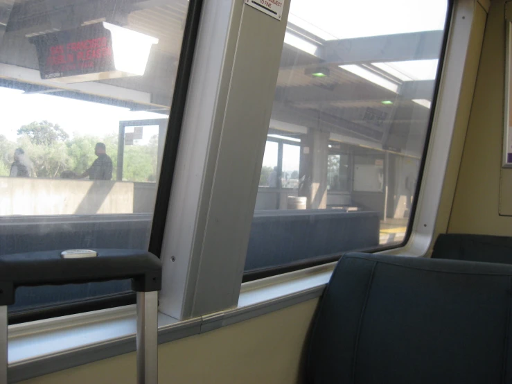 a window is looking at people walking in the subway