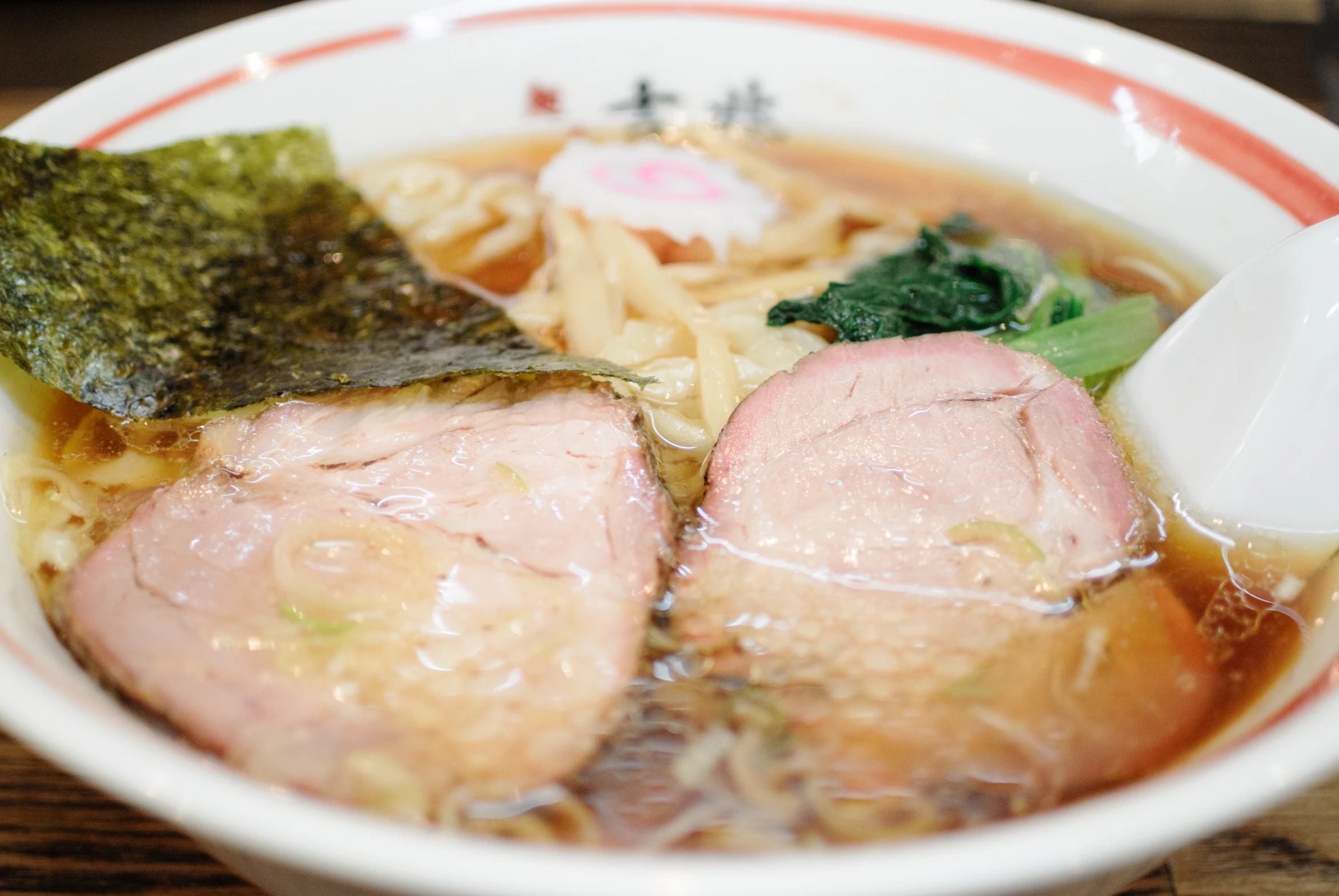 a bowl filled with ramen, noodles, and vegetables