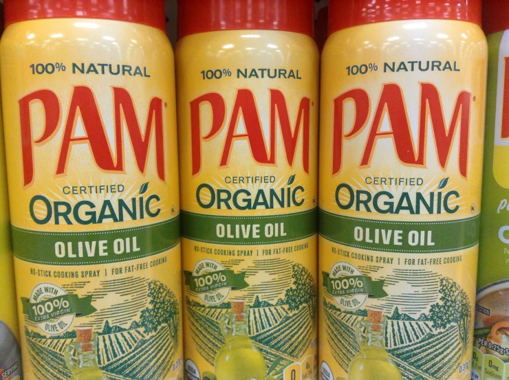 organic olive oil on a store shelf in the process of being packaged