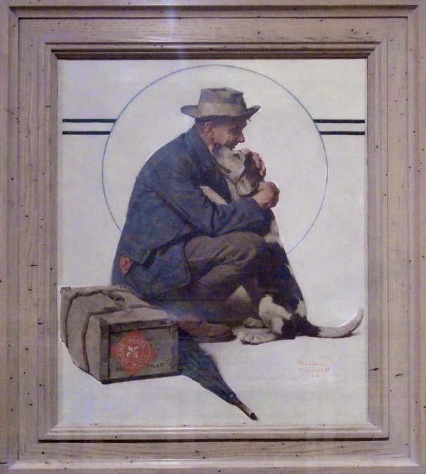 a man with a dog sits in front of a painting