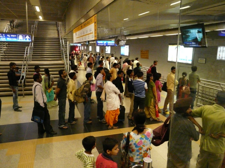 a group of people are standing around