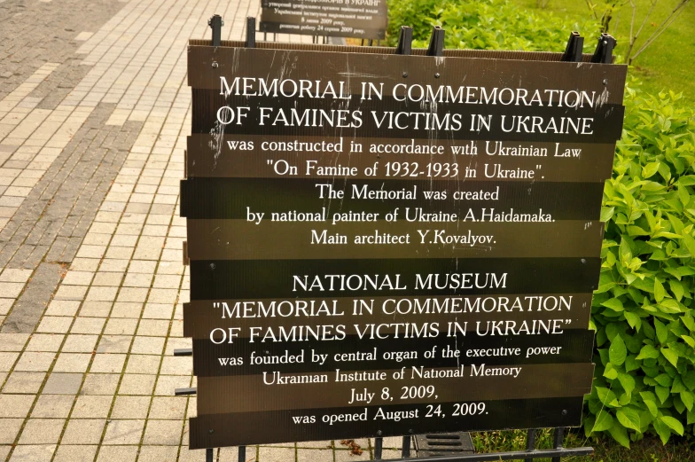 a sign on a side walk explaining information