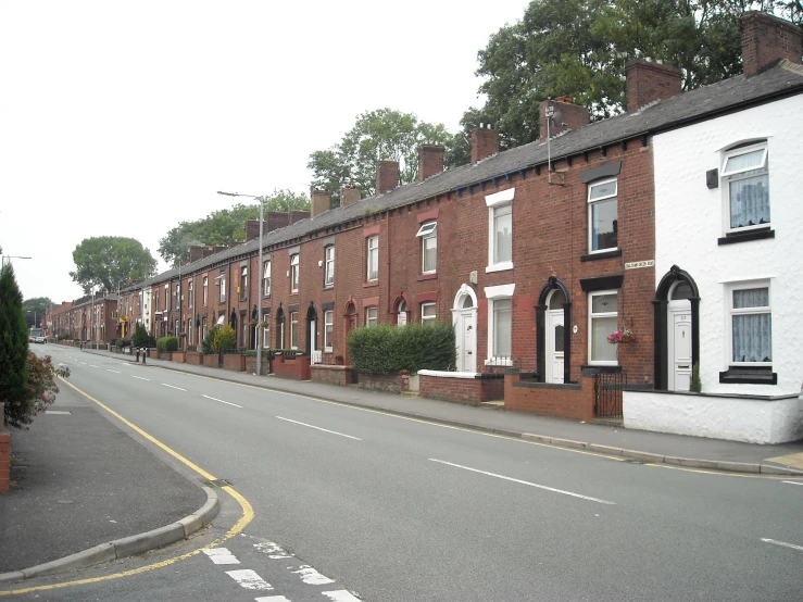 a quiet street in an urban area during the day