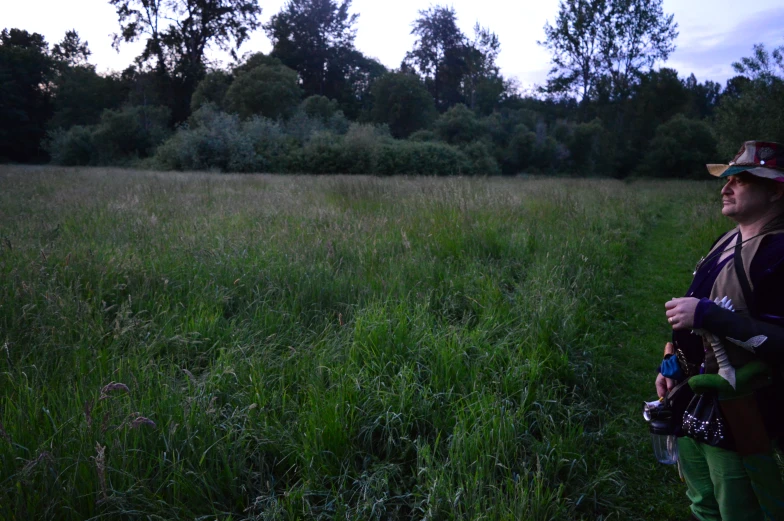 the lady is taking a picture in a field