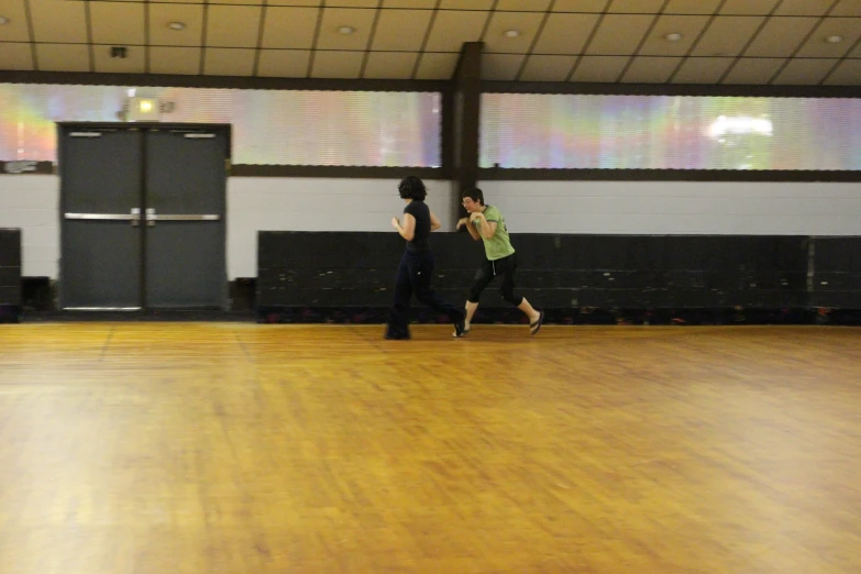 two people in a gym area playing a game