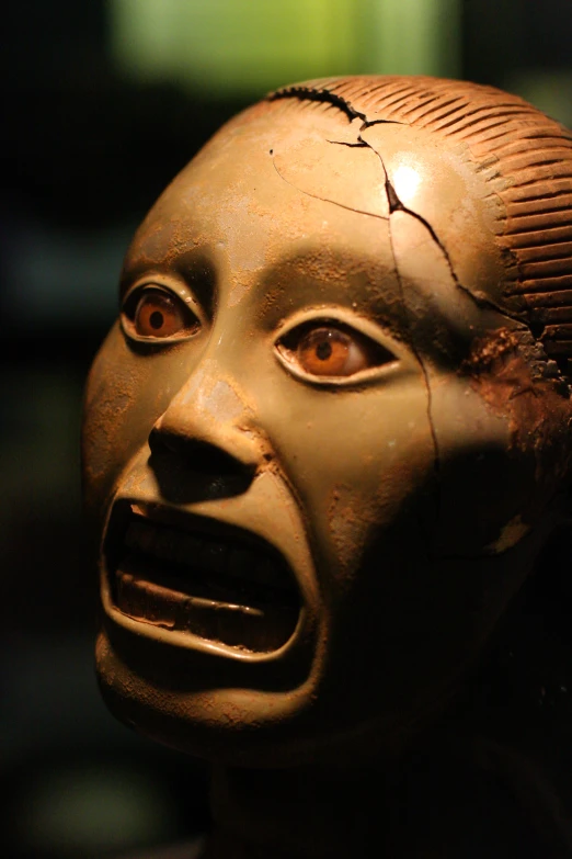 a creepy face made from a clay head