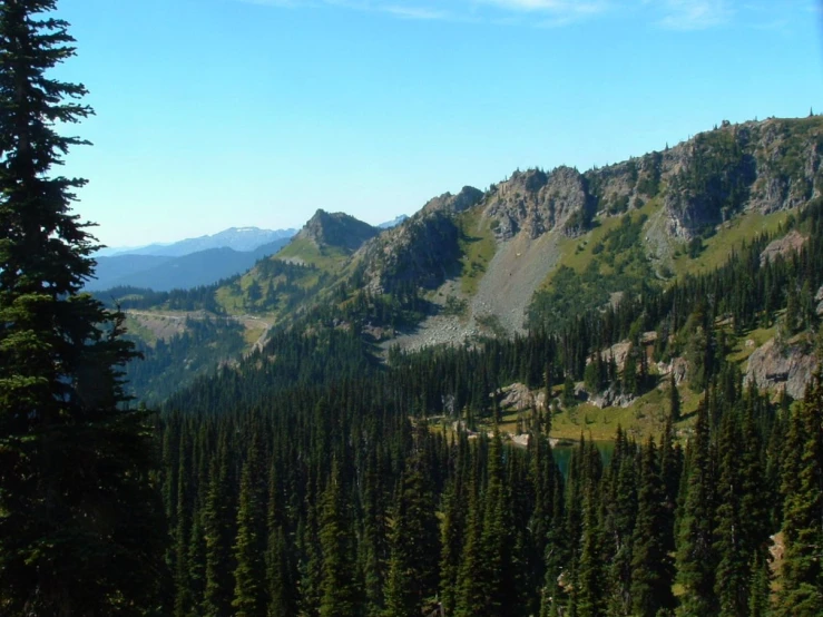 a view down a mountain side in the country