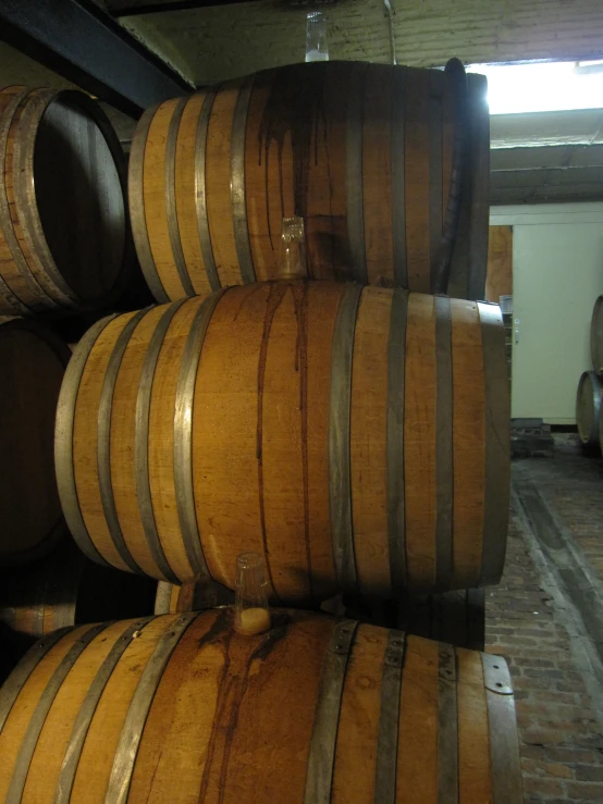 barrels stacked on top of each other in a building