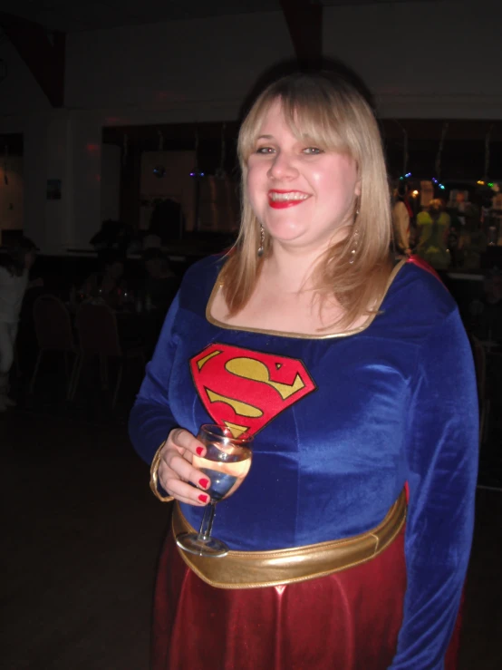 a women in blue and red caped outfit