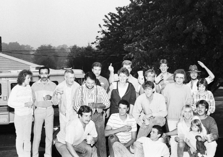 the group is posing for a black and white po