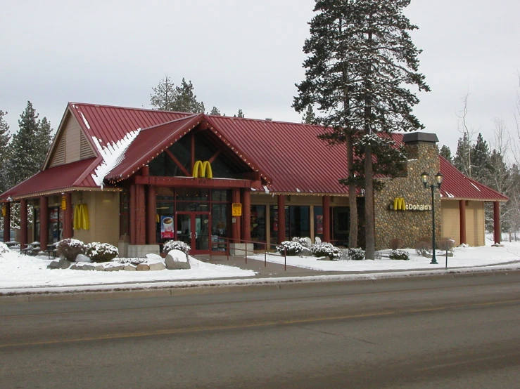 an mcdonalds on a winter's day in the snow