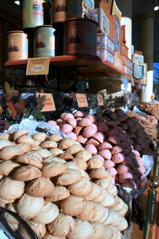 a pile of round cookies sitting on top of a display case