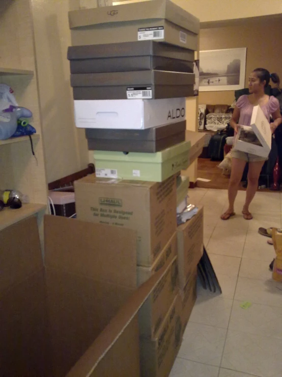 some boxes stacked and two women in a room