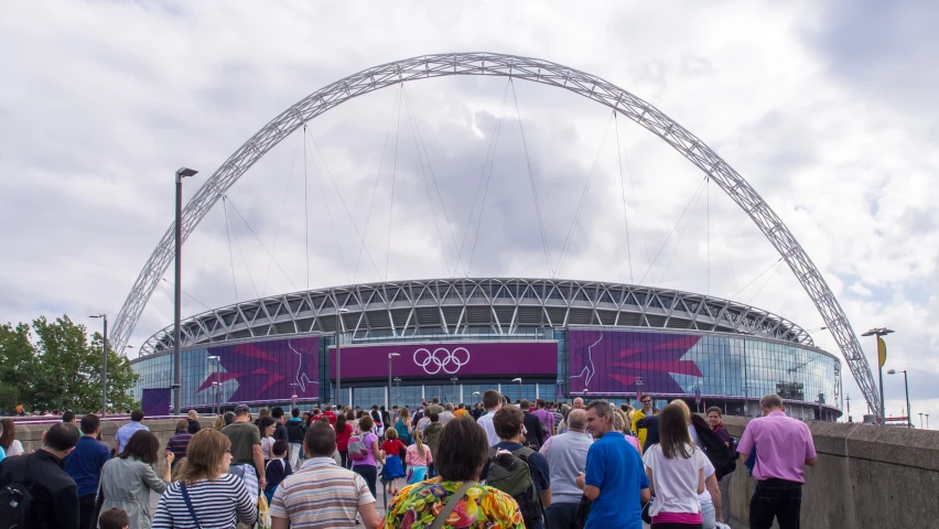 large group of people in front of a large arena