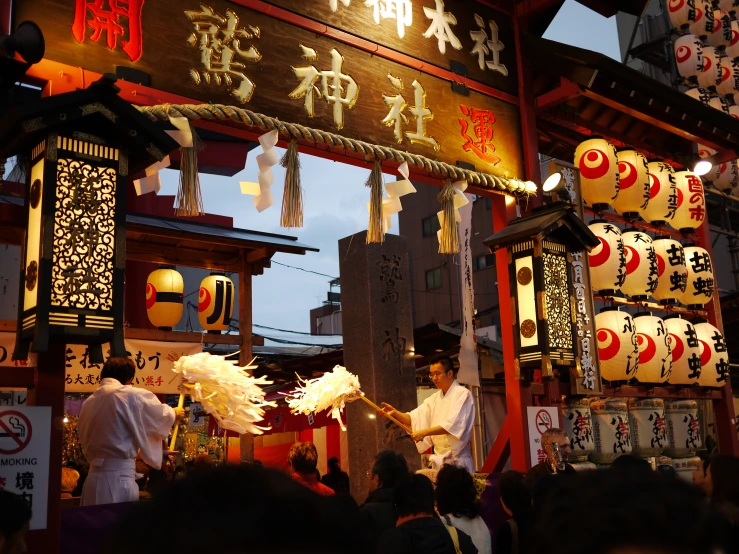 an oriental market with signs and people inside