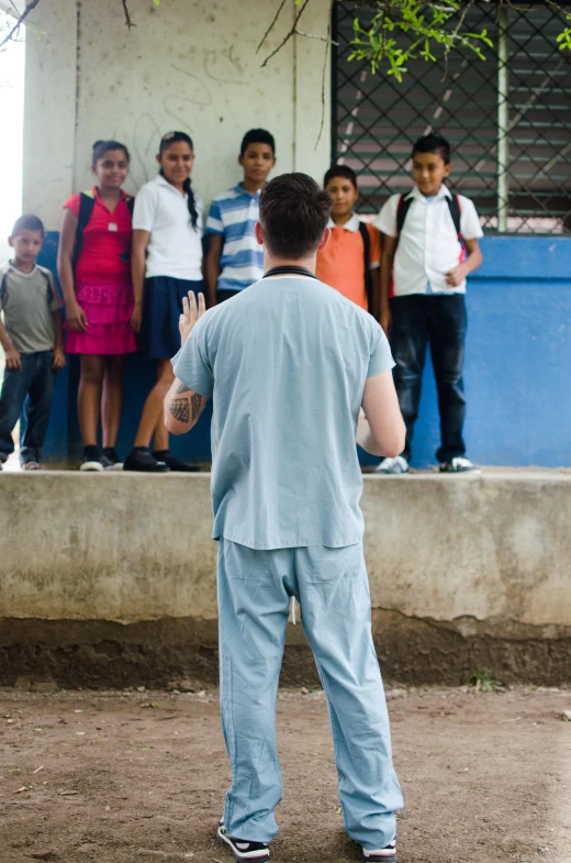 a man standing outside watching people watch him