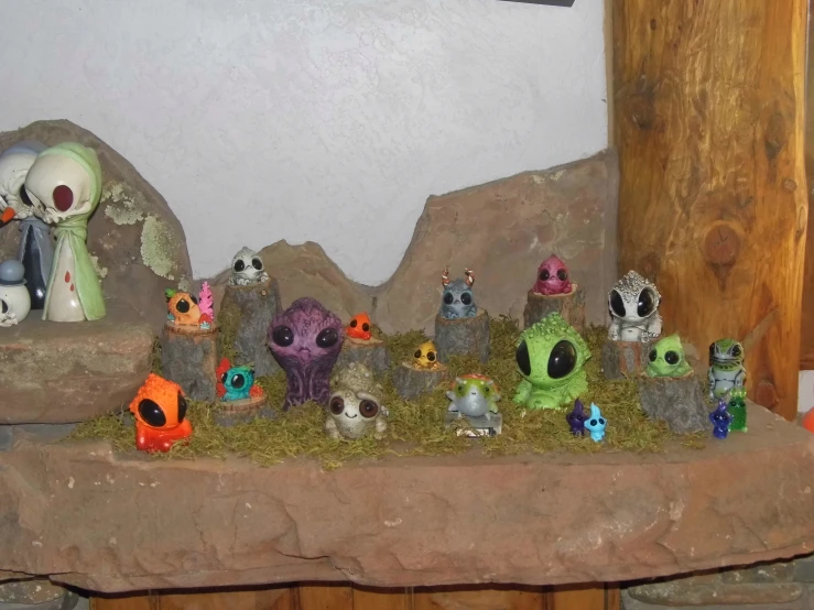 a large group of small monsters and their baby ones