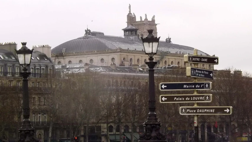 there are several street signs on the city side