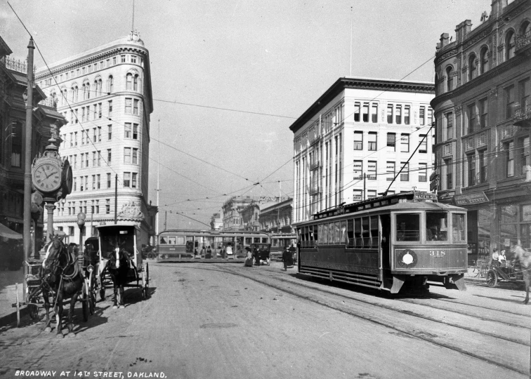 an old po of trolley cars on the street