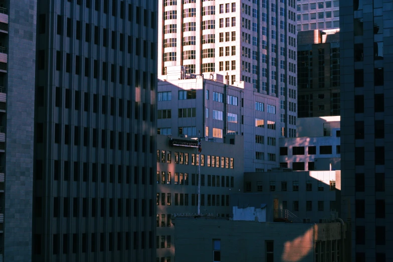 tall building sitting on top of a city