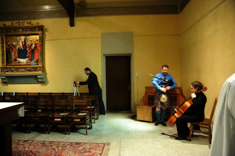 people standing in a building near a doorway