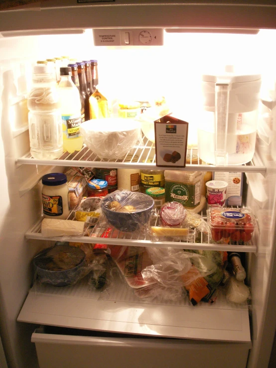 an open fridge with all the food inside