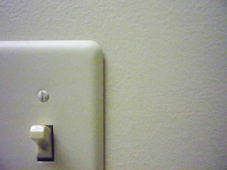 a single light switch is shown near the wall