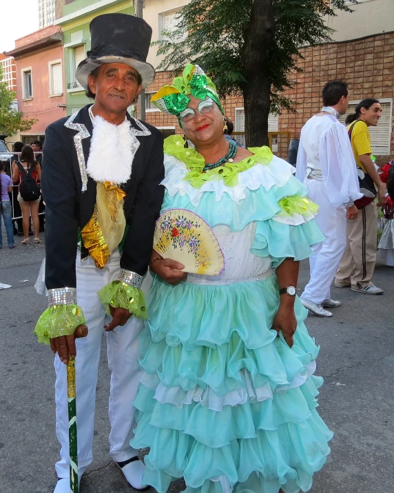 two people that are standing together wearing costumes