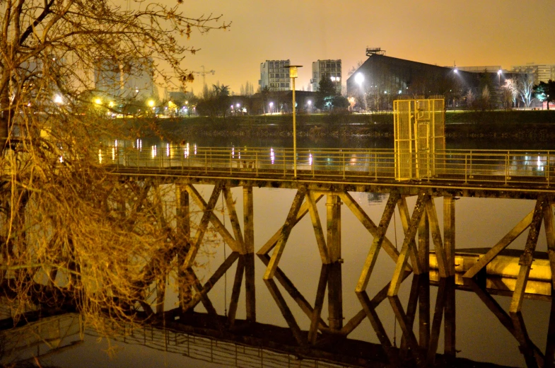 a pier sits in a city area that is flooded