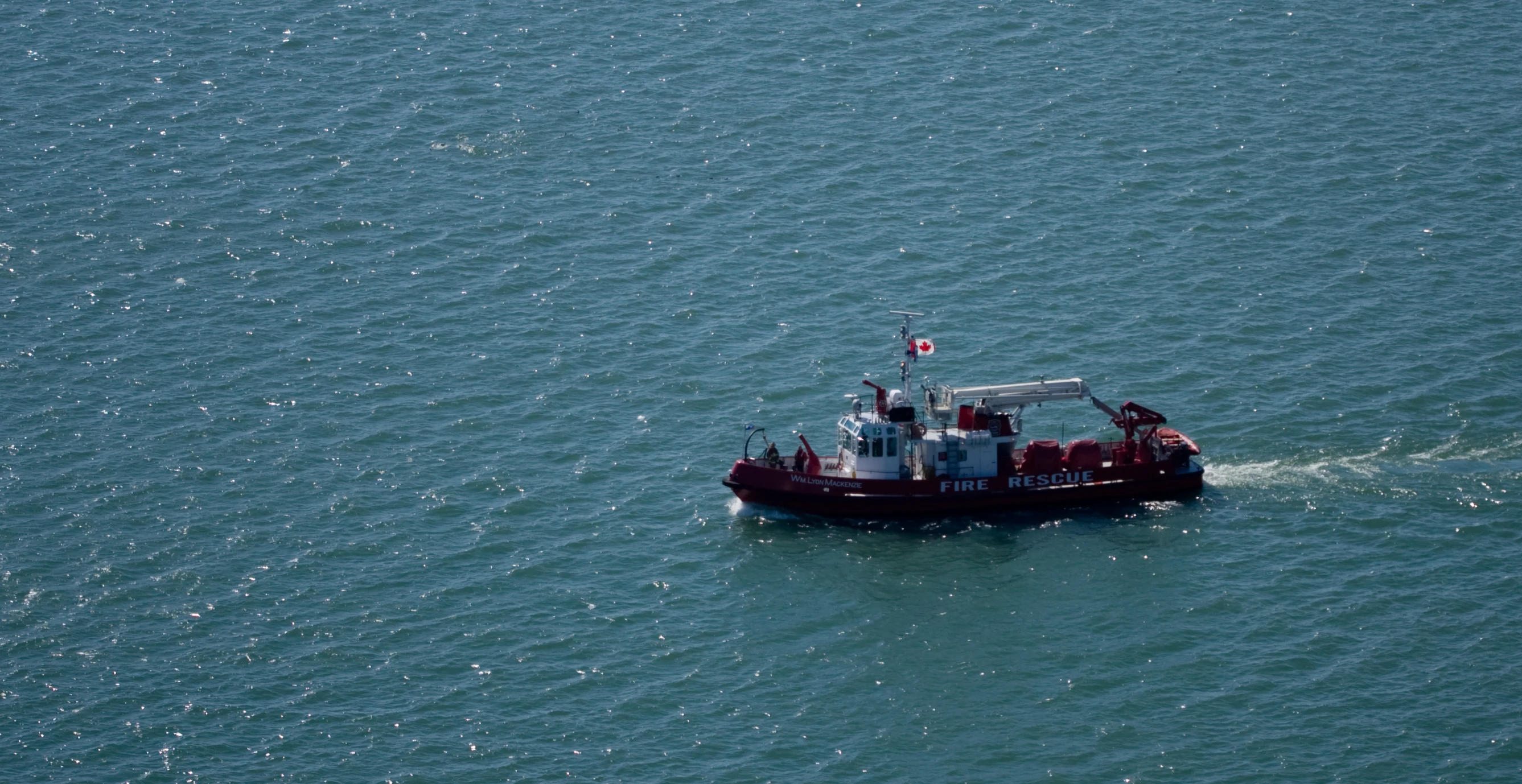 a large boat moves across the ocean