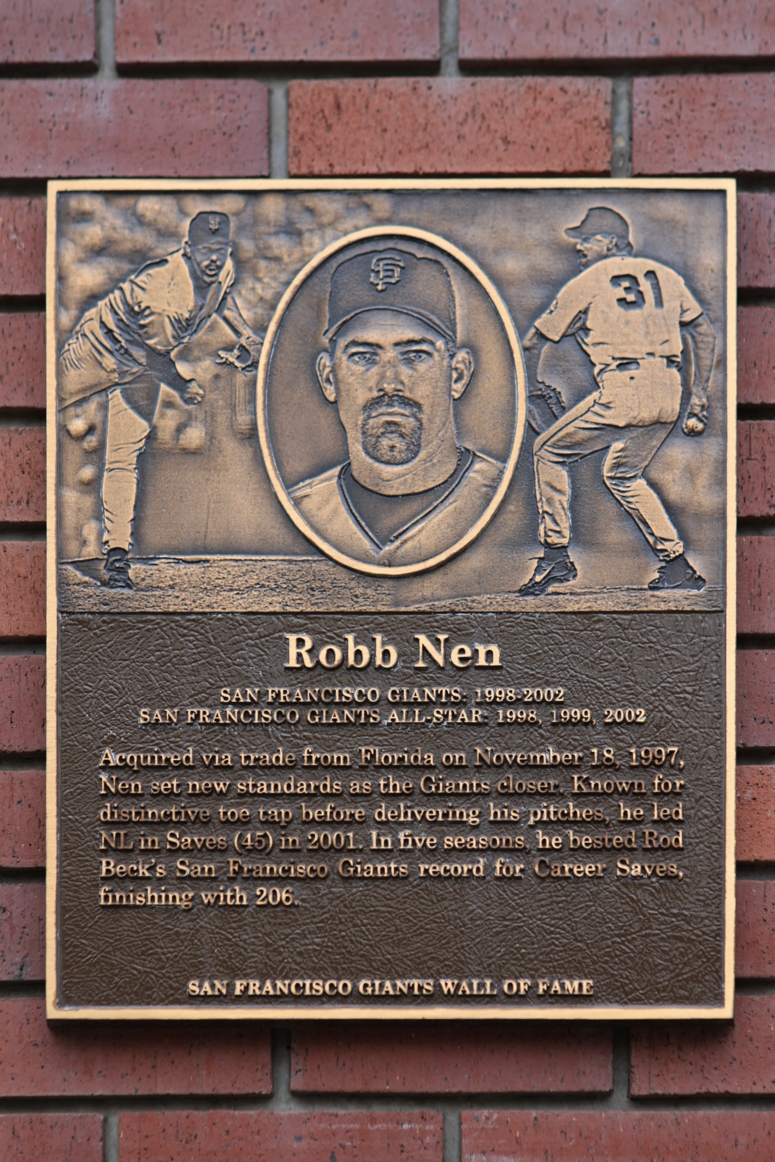 a plaque on a brick wall commemorating robb nen