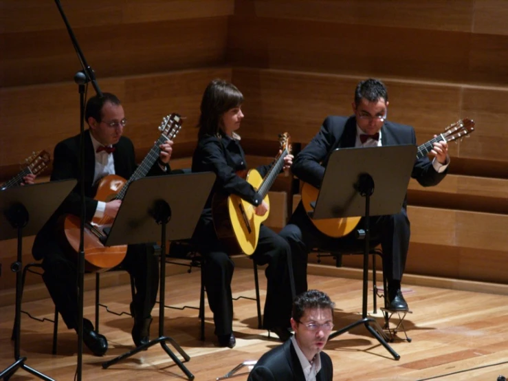 an orchestra playing on instruments and singing