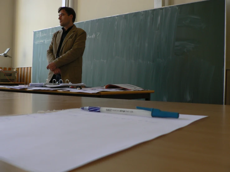 a person in a room with several different objects on the table