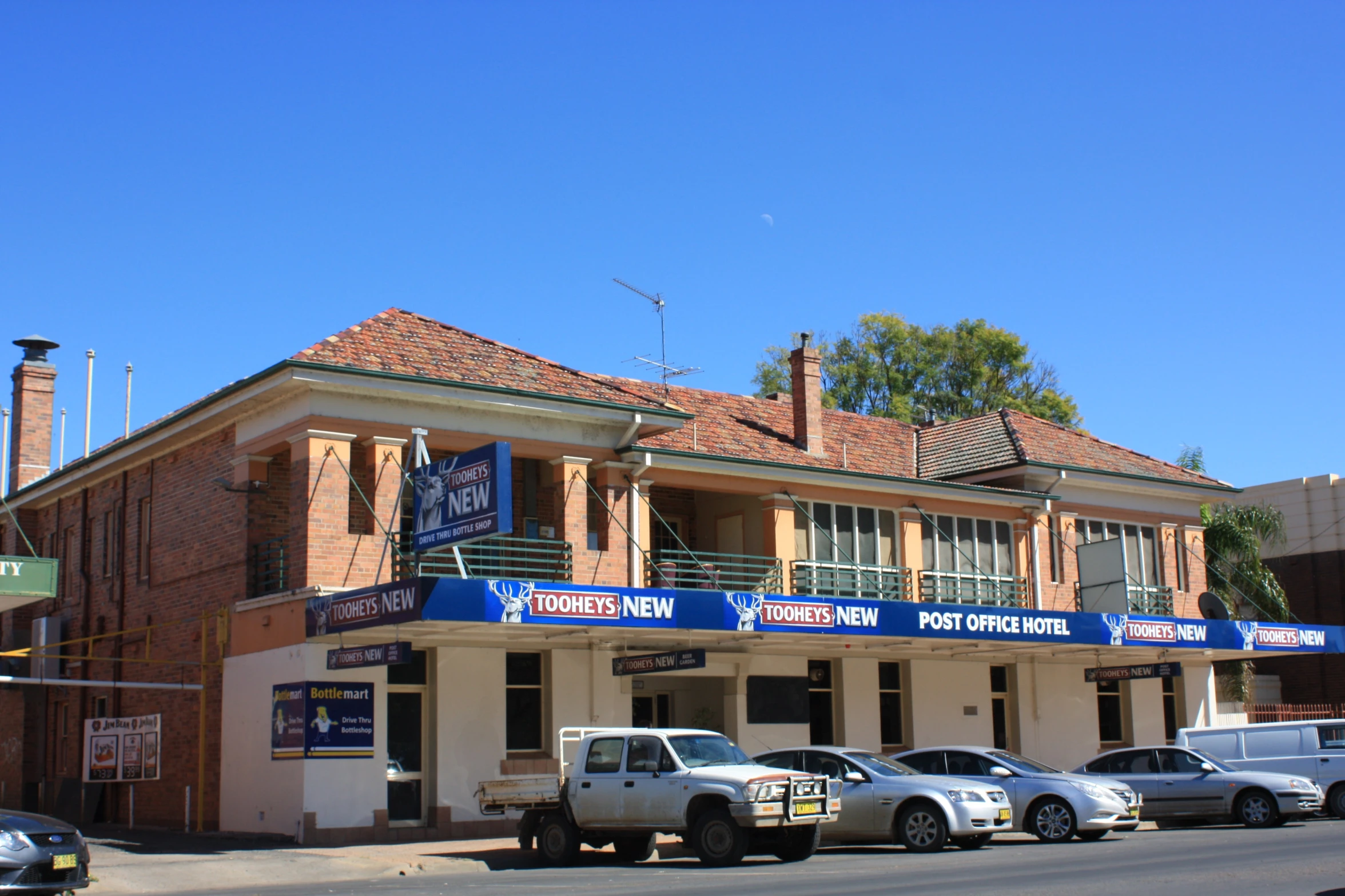 the building has three stories of red brick